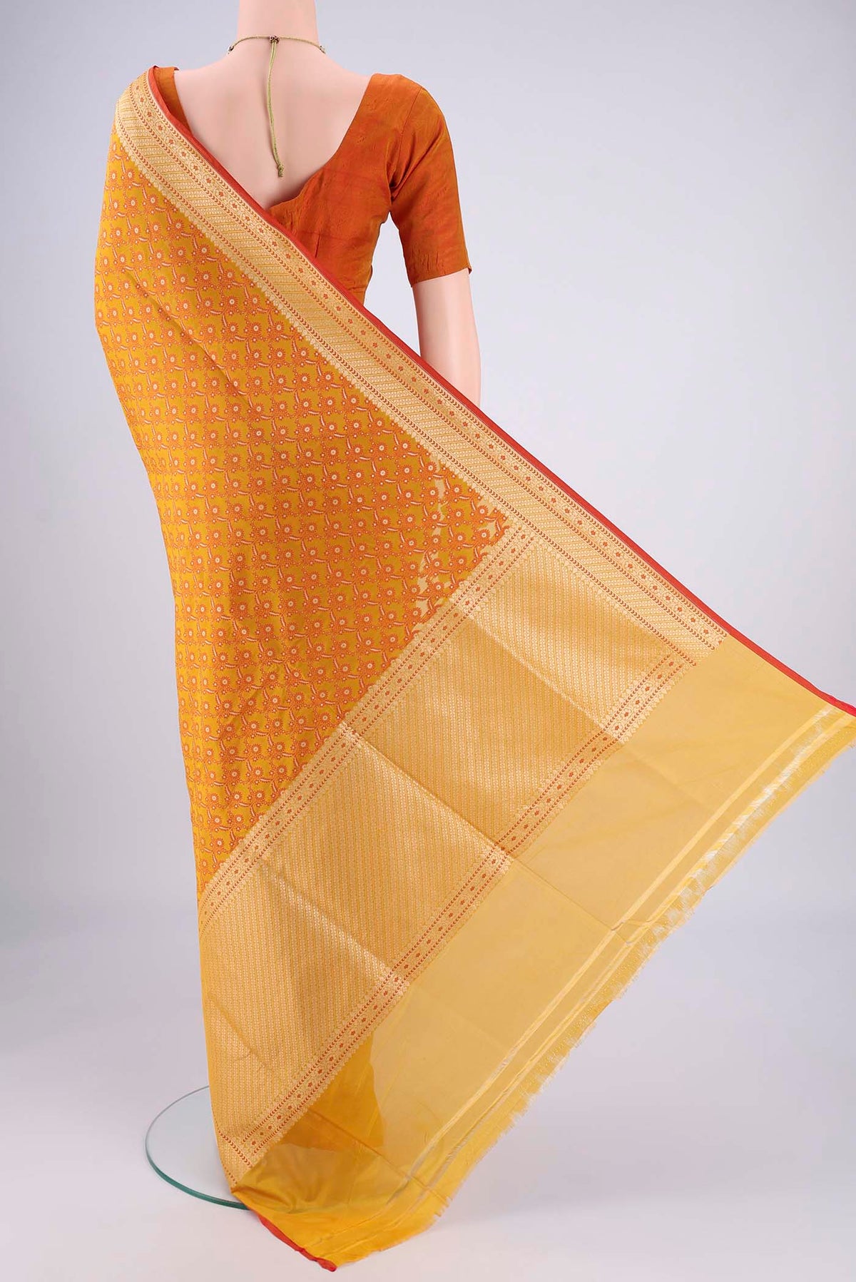 Flat view of Mustard Banarasi Silk Saree with Jacquard With Zari Butta on the body and Zari Border. 