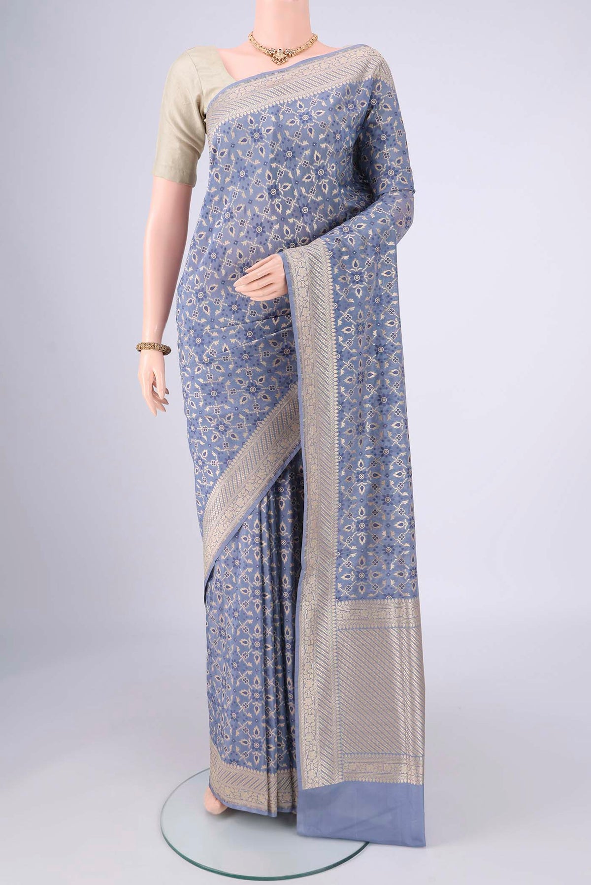 Blue Grey Banarasi Silk Saree with Zari Brocade on the body and Zari Border.  displayed on a mannequin