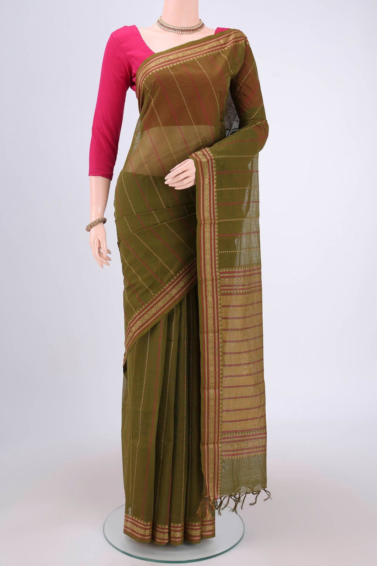 Olive Green Kanchi Cotton Saree with Stripes on the body and Thread Border.  displayed on a mannequin