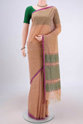 Beige Coimbatore Cotton Saree with Thread Butta on the body and Thread Border.  displayed on a mannequin