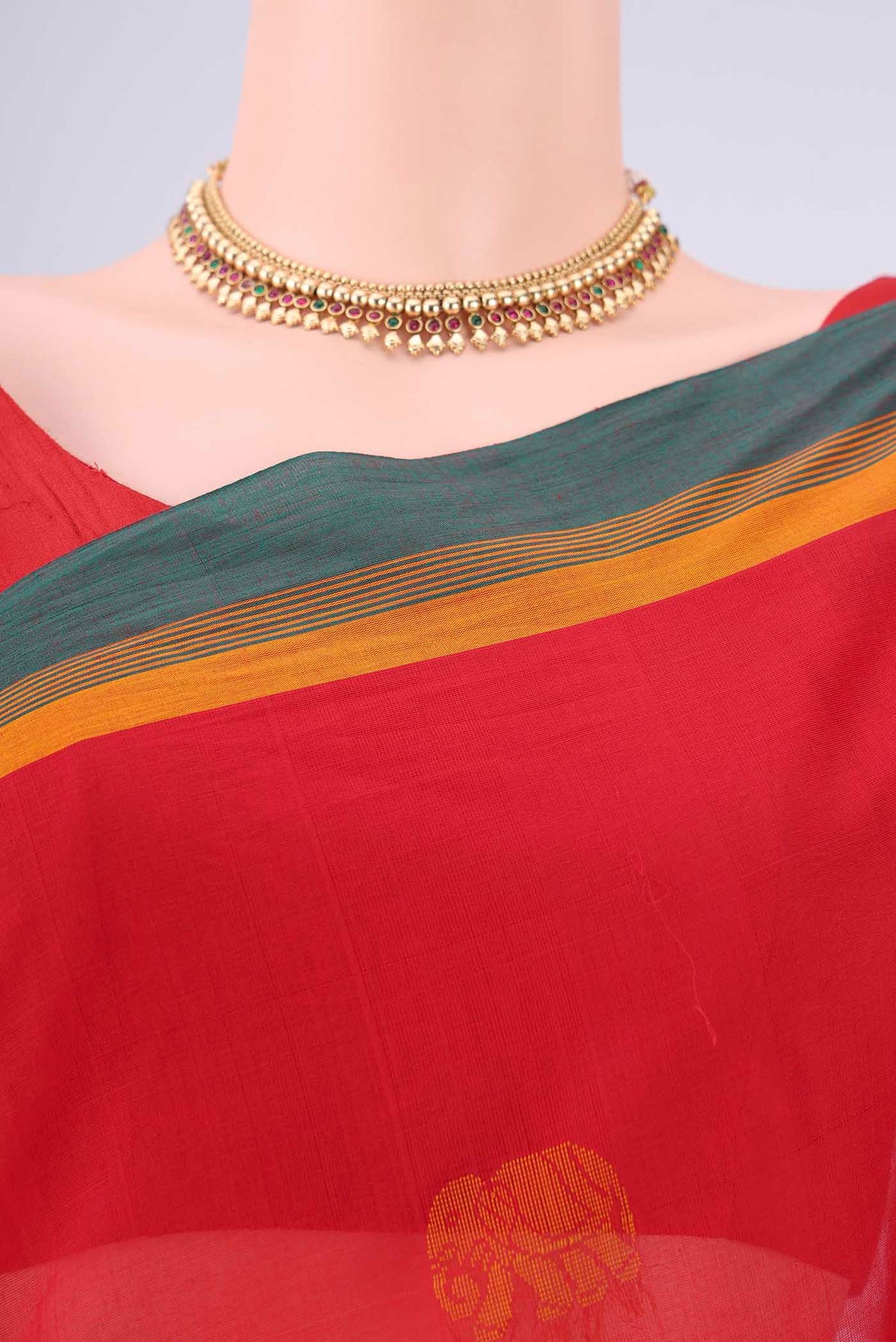 Border image of Red Coimbatore Cotton Saree with Thread Butta on the body and Plain Border. 