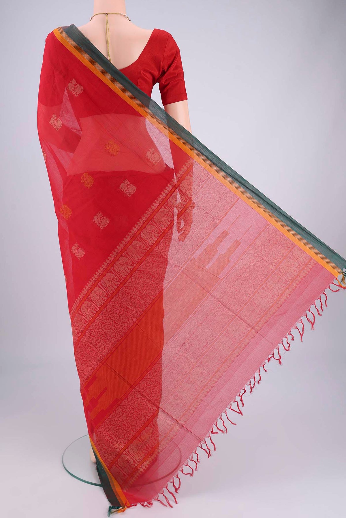 Flat view of Red Coimbatore Cotton Saree with Thread Butta on the body and Plain Border. 