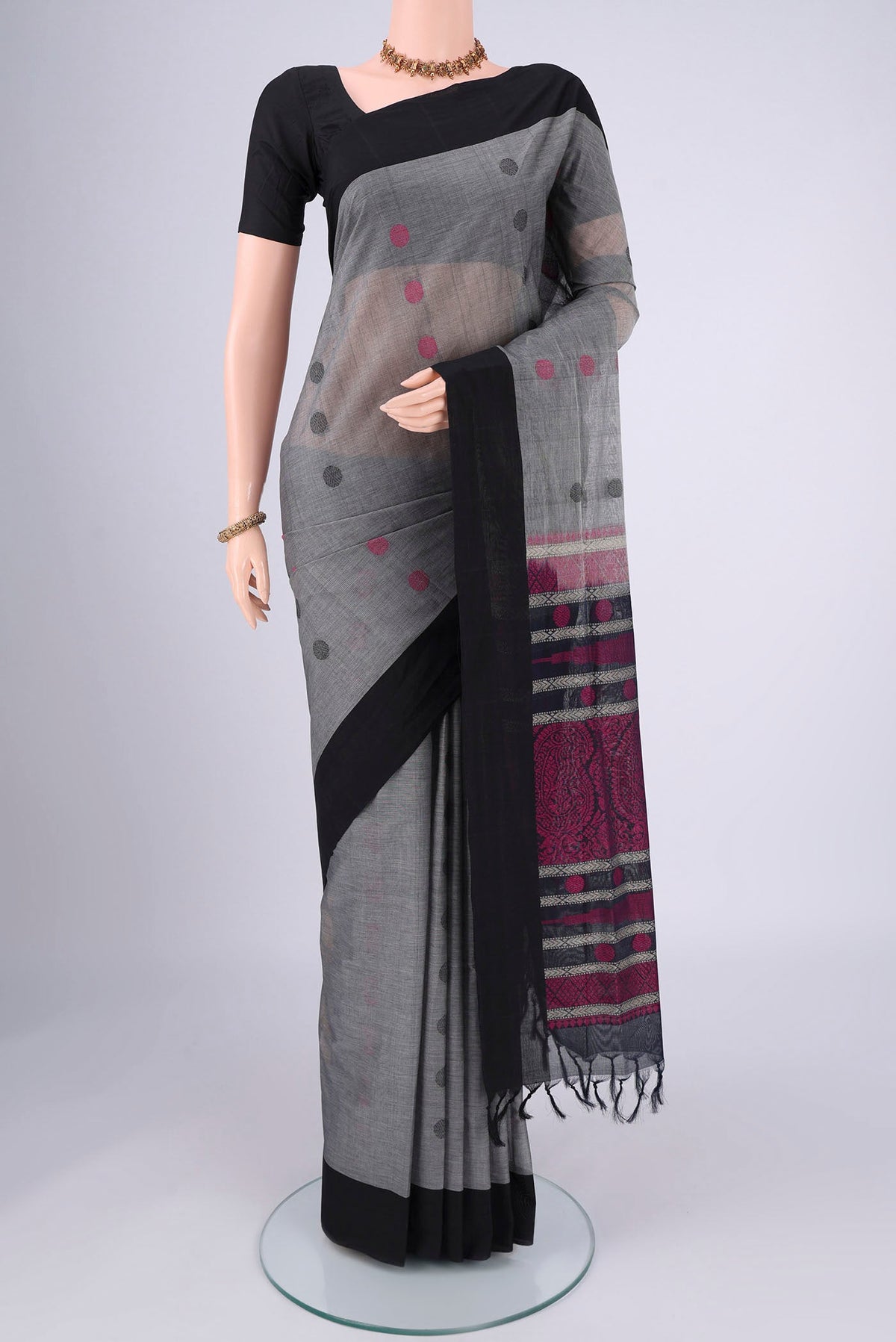 Grey Coimbatore Cotton Saree with Thread Butta on the body and Plain Border.  displayed on a mannequin