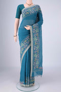 Blue Linen Cotton Saree with Kantha Work on the body and Thread Border.  displayed on a mannequin