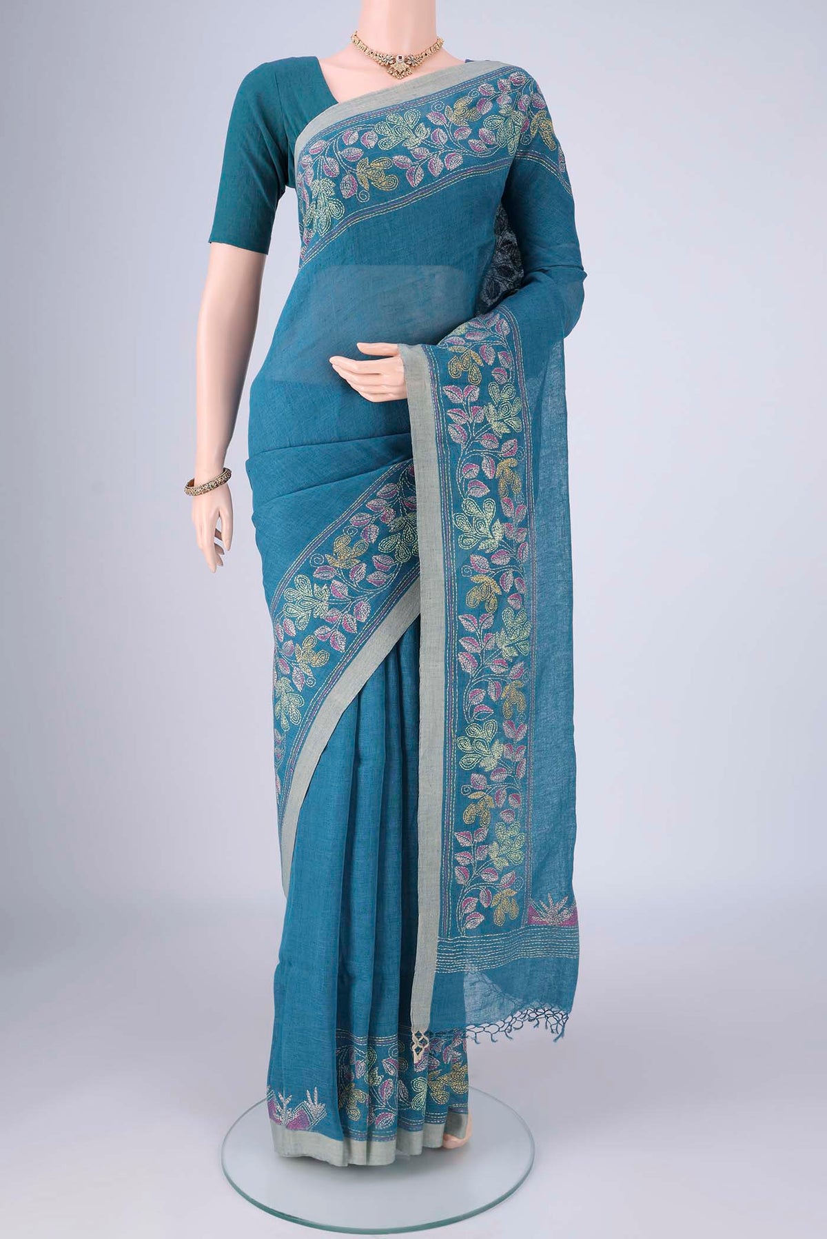 Blue Linen Cotton Saree with Kantha Work on the body and Thread Border.  displayed on a mannequin