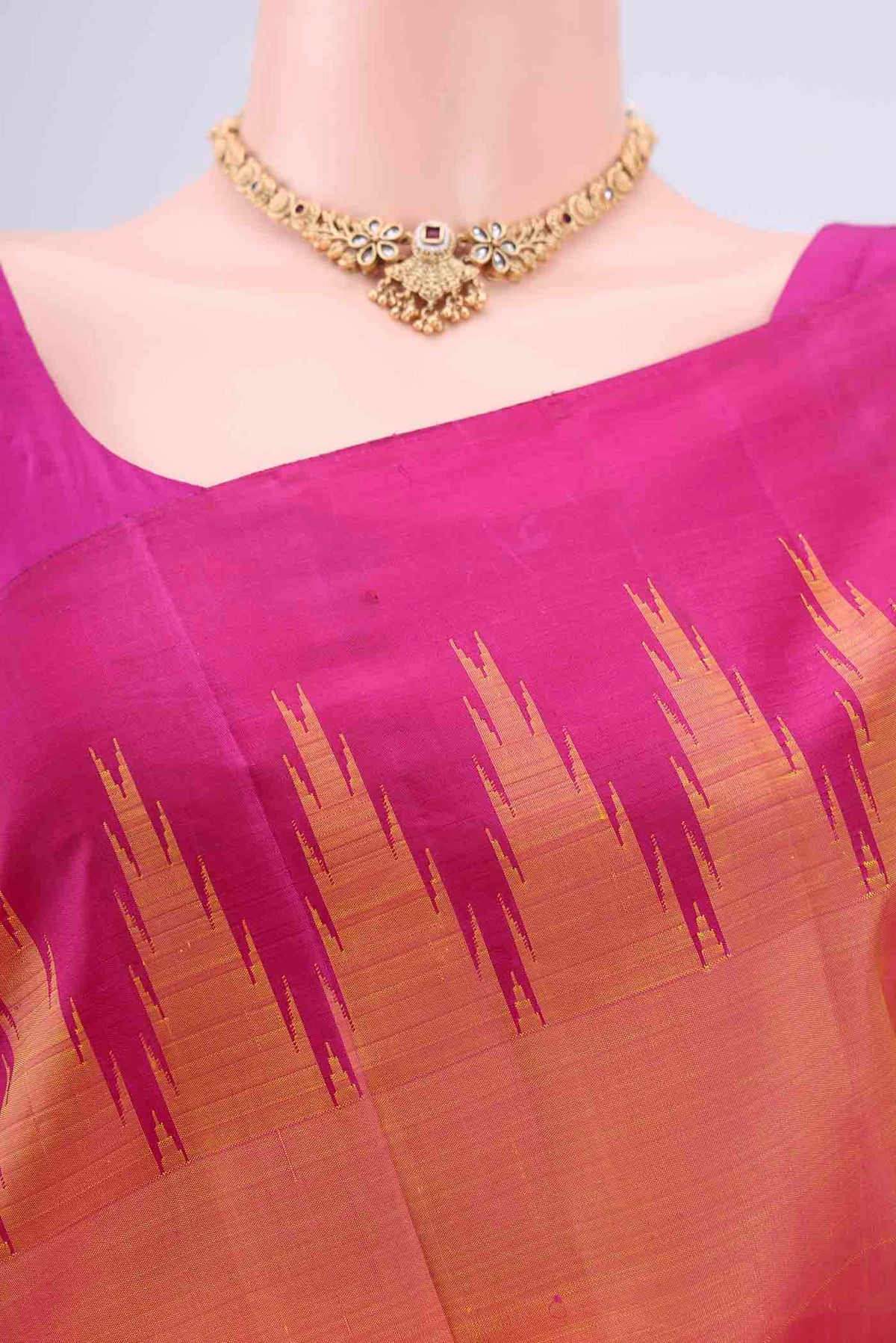 Border image of Peach Kanchipuram Silk Saree with Plain Body and Temple Border. 