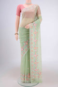 Light Green Blended Kota Cotton Saree with Thread Butta on the body and Embroidery Border.  displayed on a mannequin