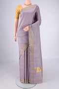 Lilac Kanchipuram Silk Saree with Plain Body and Zari Border.  displayed on a mannequin
