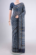 Indigo Maheshwari Silk Cotton Saree with Batik Print on the body and Zari Border.  displayed on a mannequin