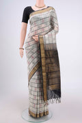 Off White Coimbatore Silk Cotton Saree with Checked design on the body and Zari Border.  displayed on a mannequin