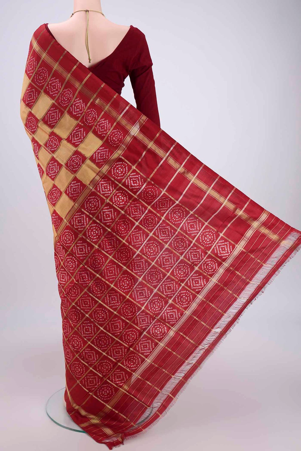 Flat view of Peach Pochampally Silk Saree with Checked design on the body and Zari Border. 