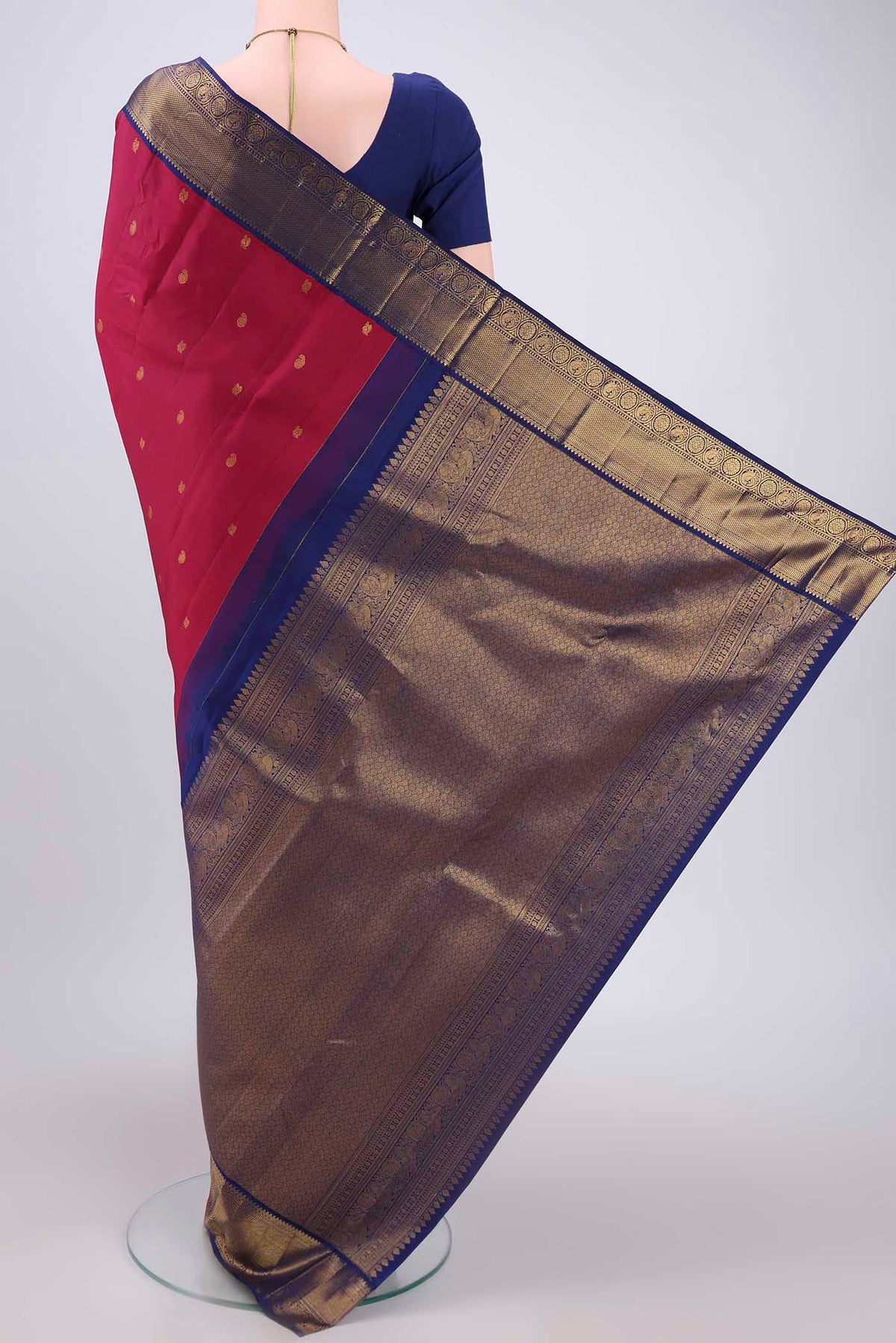 Flat view of Dark Pink Kanjivaram Silk Saree with Zari Butta on the body and Zari Border. 