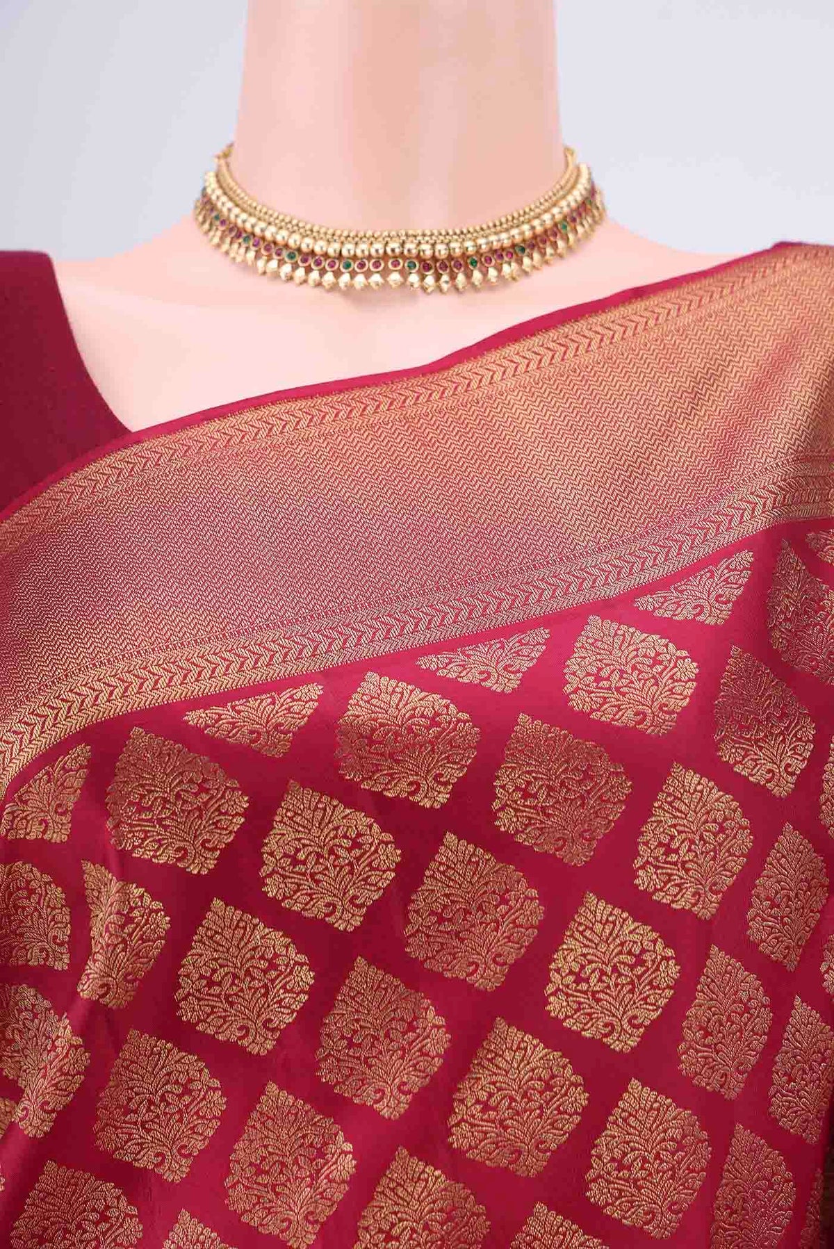Border image of Maroon Kanjivaram Silk Saree with Zari Brocade on the body and Zari Border. 