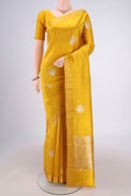 Lemon Yellow Banarasi Katan Silk Saree with Zari Butta on the body and Zari Border.  displayed on a mannequin