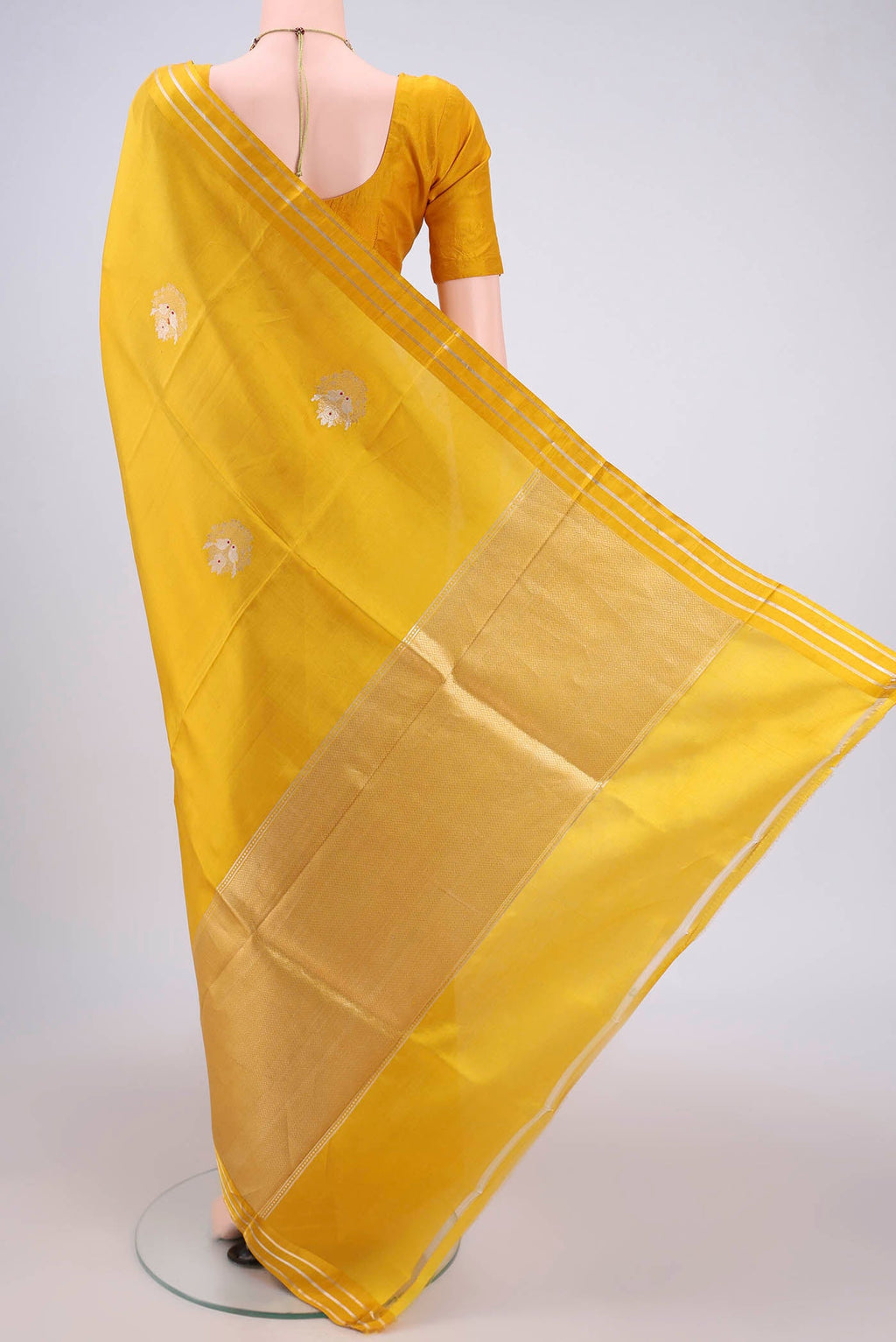 Flat view of Lemon Yellow Banarasi Katan Silk Saree with Zari Butta on the body and Zari Border. 