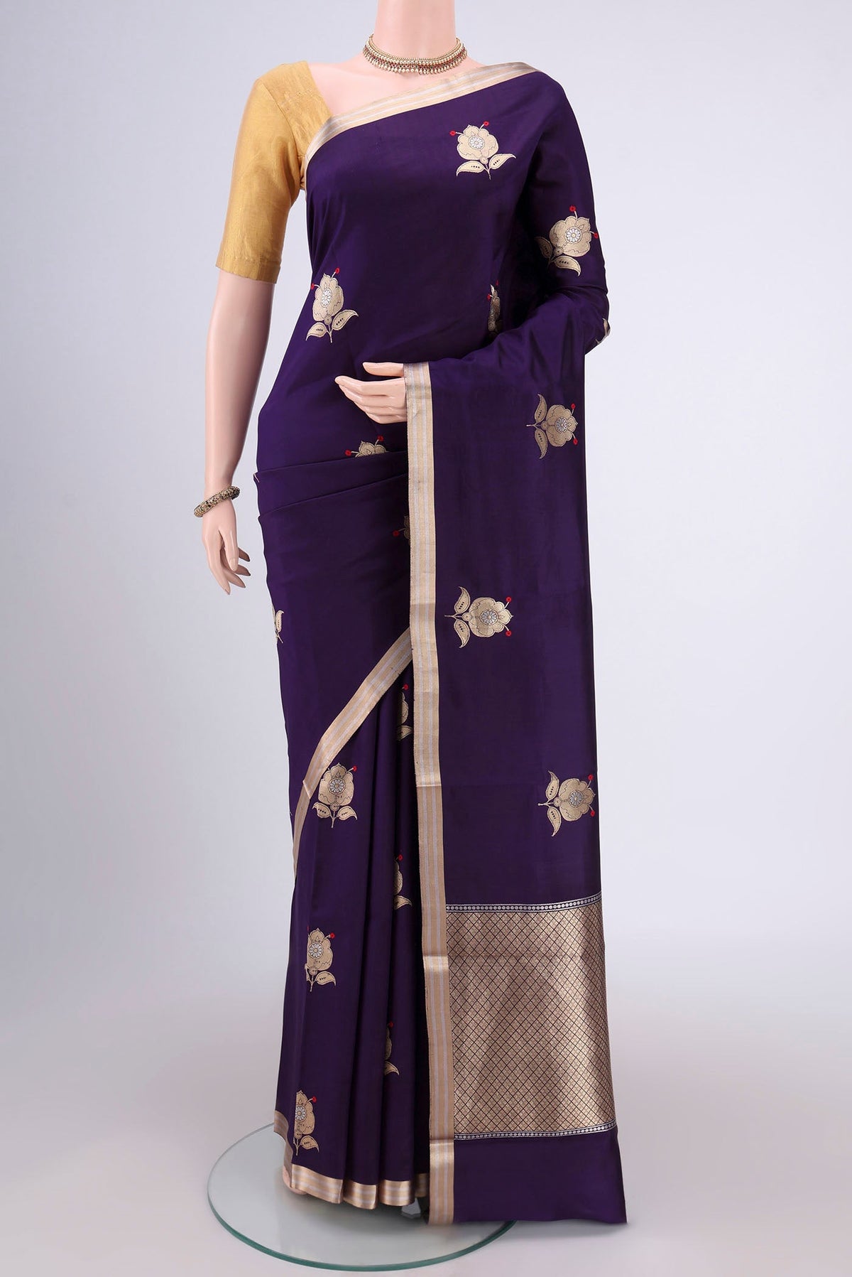 Purple Banarasi Katan Silk Saree with Zari Butta on the body and Zari Border.  displayed on a mannequin
