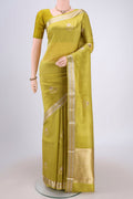 Light Green Banarasi Katan Silk Saree with Zari And Thread Butta on the body and Zari Border.  displayed on a mannequin