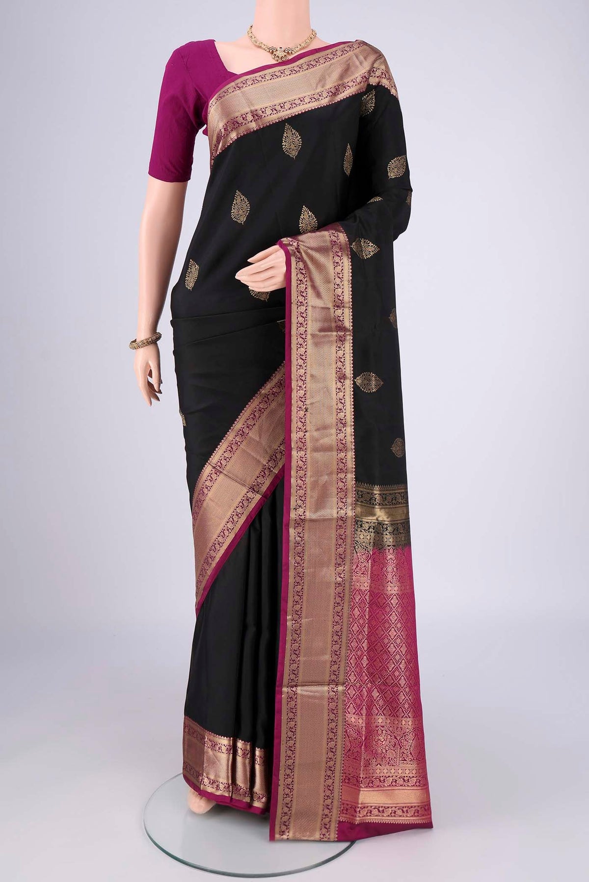 Black Dual Tone Soft Silk Saree with Zari Brocade on the body and Zari Border.  displayed on a mannequin