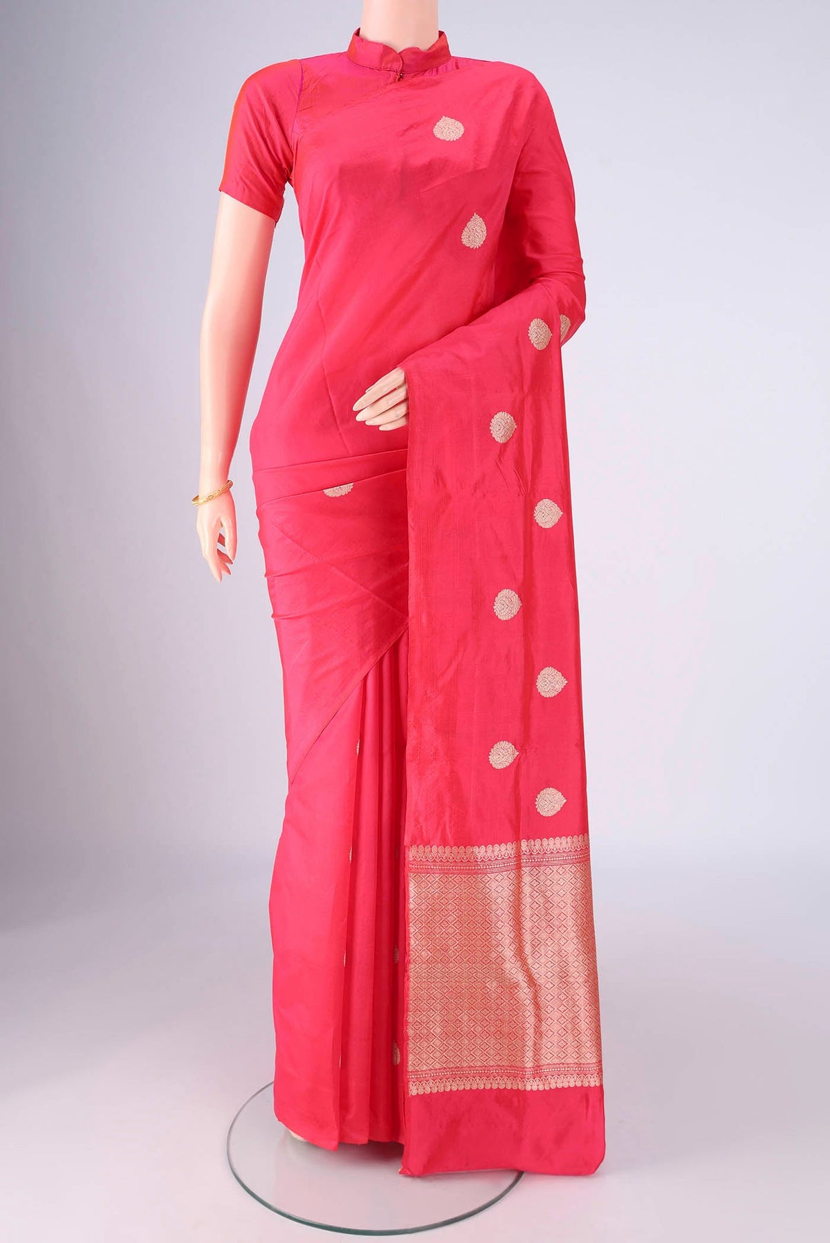 Dark Pink Dual Tone Banarasi Silk Saree with Zari Butta on the body and Without Border.  displayed on a mannequin