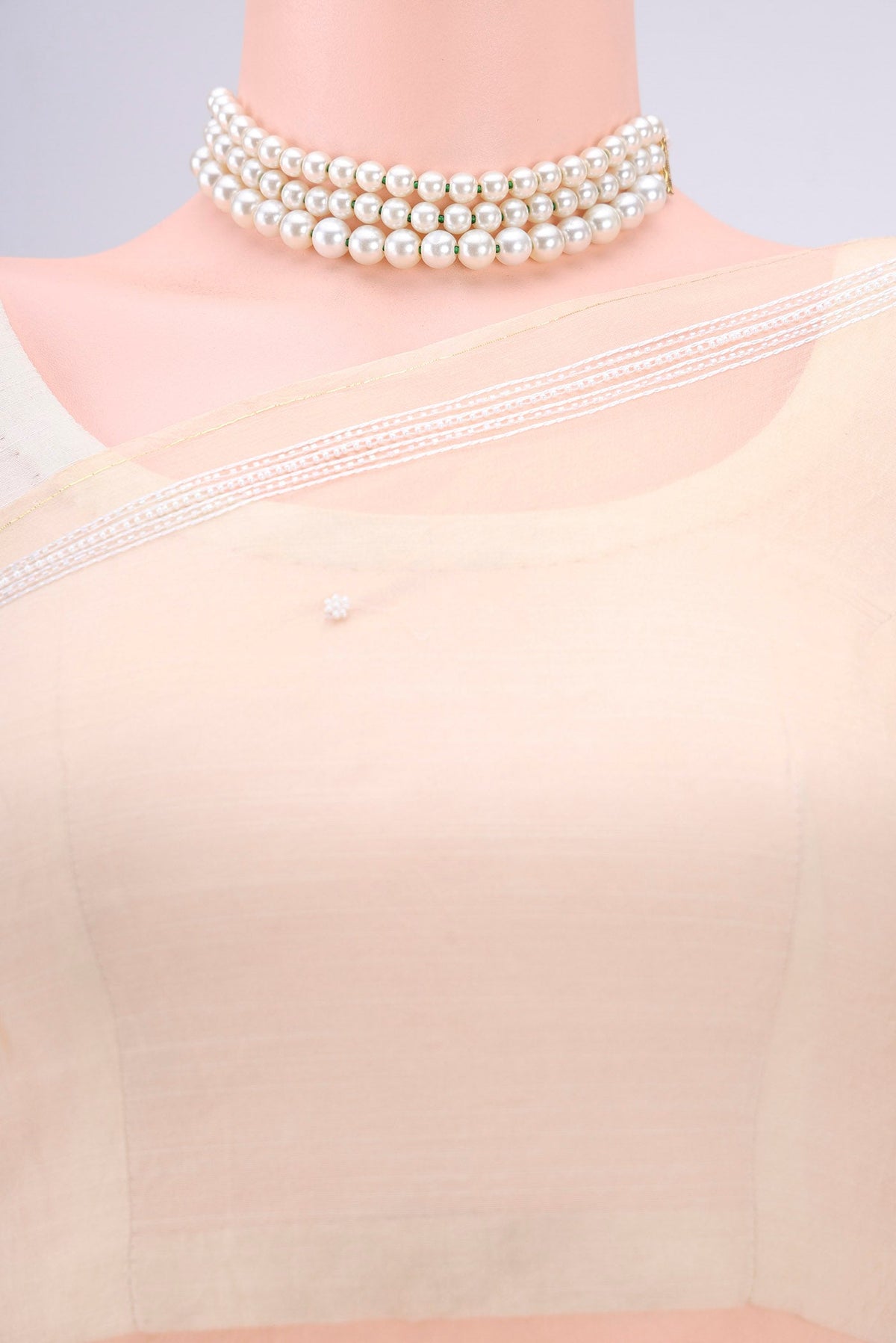 Border image of Beige Organza Silk Saree with Embroidery on the body and Thin Zari Line. 