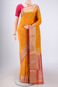 Yellow Soft Silk Saree with Zari Butta on the body and Zari Border.  displayed on a mannequin