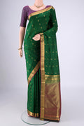 Bottle Green Nangavalli Silk [ Salem ] Saree with Zari Butta on the body and Zari Border.  displayed on a mannequin