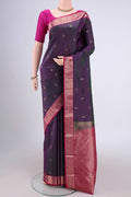 Purple with Green Color Kanjivaram Silk Saree with Zari Butta on the body and Zari Border.  displayed on a mannequin