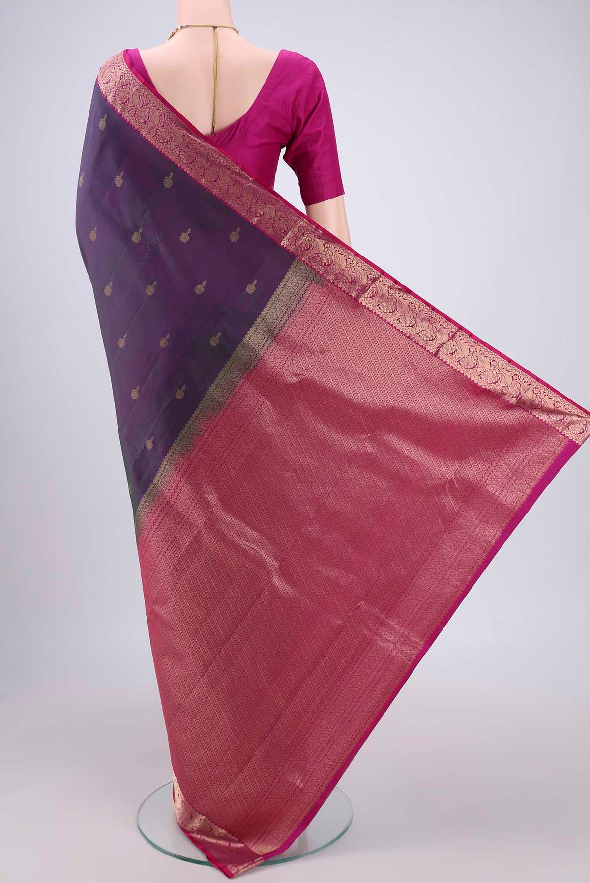 Flat view of Purple with Green Color Kanjivaram Silk Saree with Zari Butta on the body and Zari Border. 