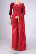 Maroon Kanchipuram Silk Saree with Checked design on the body and Zari Border.  displayed on a mannequin