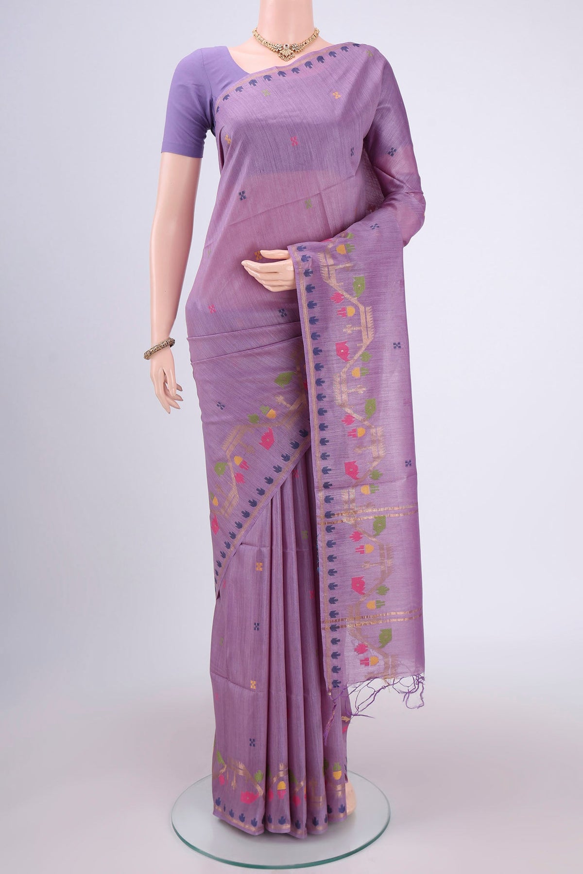 Mauve Tussar Silk Saree with Jamdani on the body and Zari Border.  displayed on a mannequin