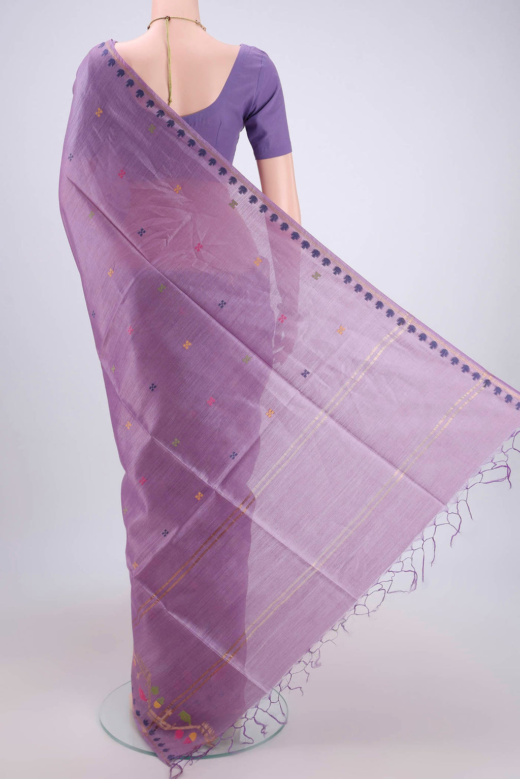 Flat view of Mauve Tussar Silk Saree with Jamdani on the body and Zari Border. 