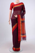 Burgundy Maheshwari Silk Cotton Saree with Plain Body and Zari Border.  displayed on a mannequin