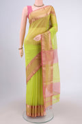 Parrot Green Maheshwari Silk Cotton Saree with Plain Body and Zari Border.  displayed on a mannequin