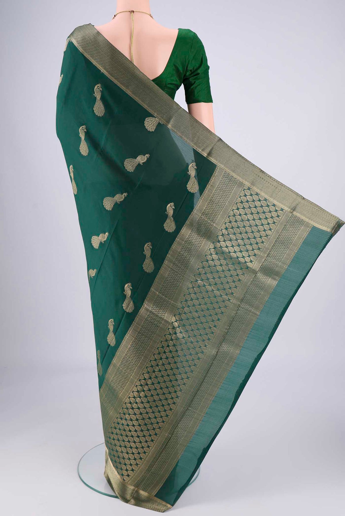 Flat view of Bottle Green Mysore Crepe Saree with Plain Body and Zari Border. 