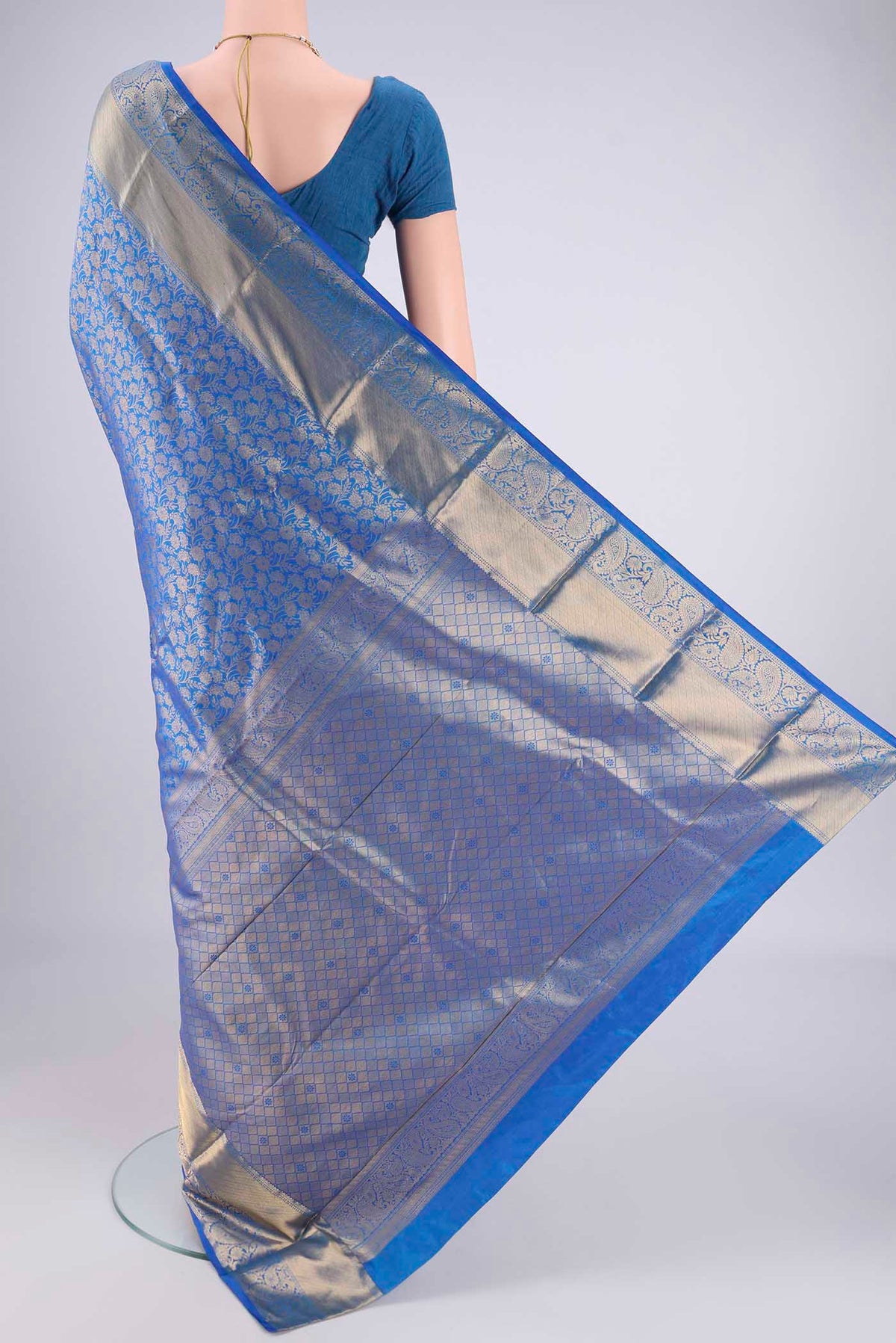 Flat view of Blue Bangalore Silk Saree with Zari Brocade on the body and Zari Border. 