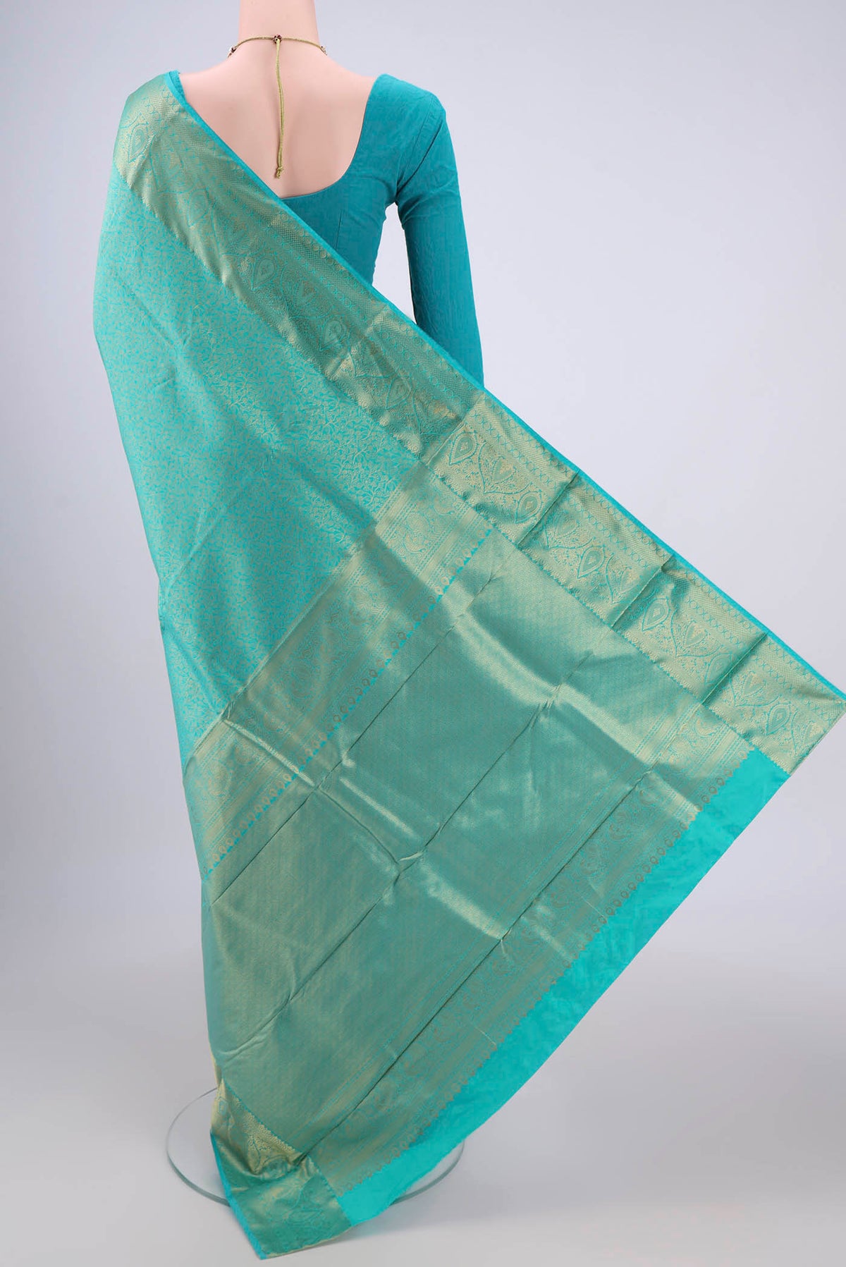 Flat view of Turquoise Dual Tone Bangalore Silk Saree with Zari Brocade on the body and Zari Border. 