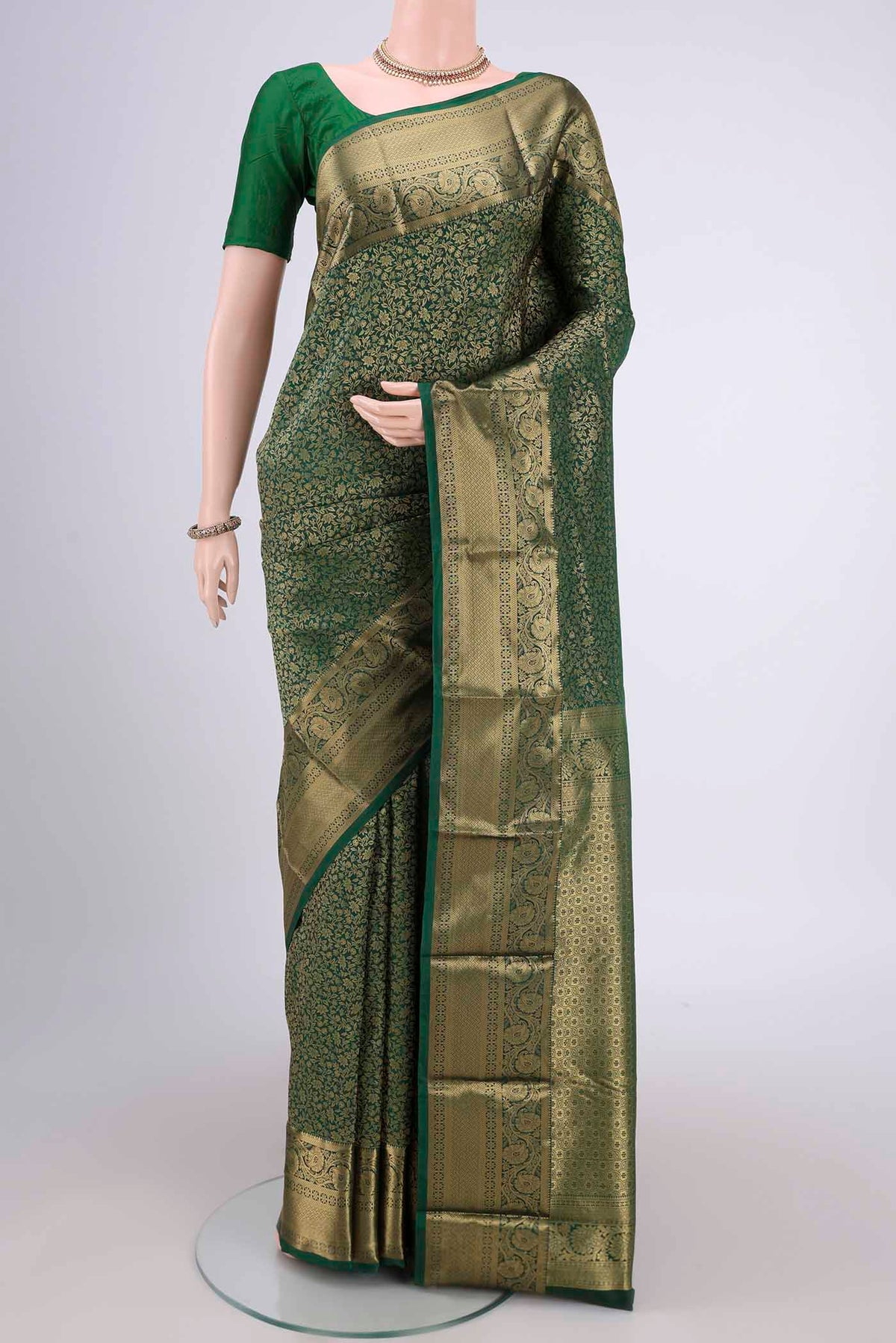 Bottle Green Dual Tone Bangalore Silk Saree with Zari Brocade on the body and Zari Border.  displayed on a mannequin