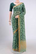 Green Mangalagiri Cotton Saree with Printed design on the body and Zari Border.  displayed on a mannequin
