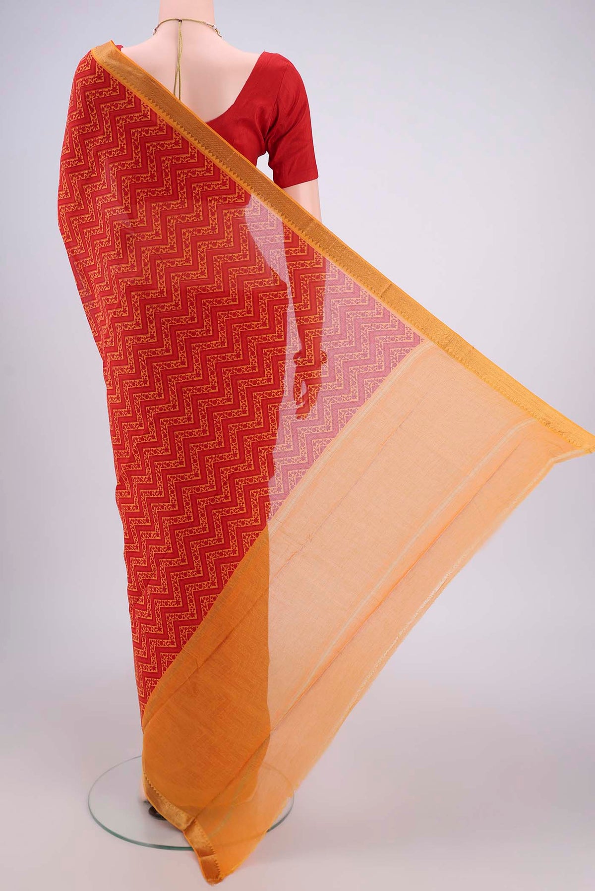 Flat view of Red Mangalagiri Cotton Saree with Printed design on the body and Zari Border. 