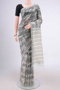 Off White Tussar Silk Saree with Printed design on the body and Plain Border.  displayed on a mannequin