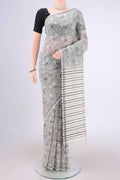 Off White Tussar Silk Saree with Printed design on the body and Plain Border.  displayed on a mannequin