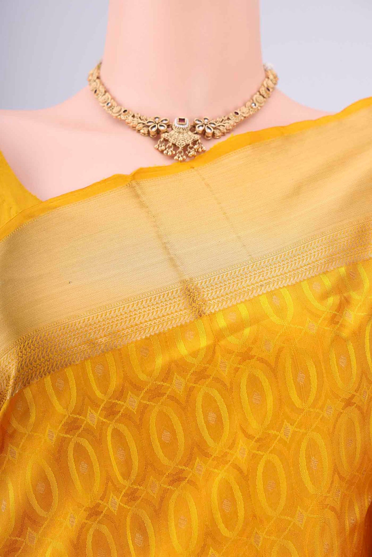 Border image of Yellow Soft Silk Saree with Jacquard With Thread Butta on the body and Zari Border. 