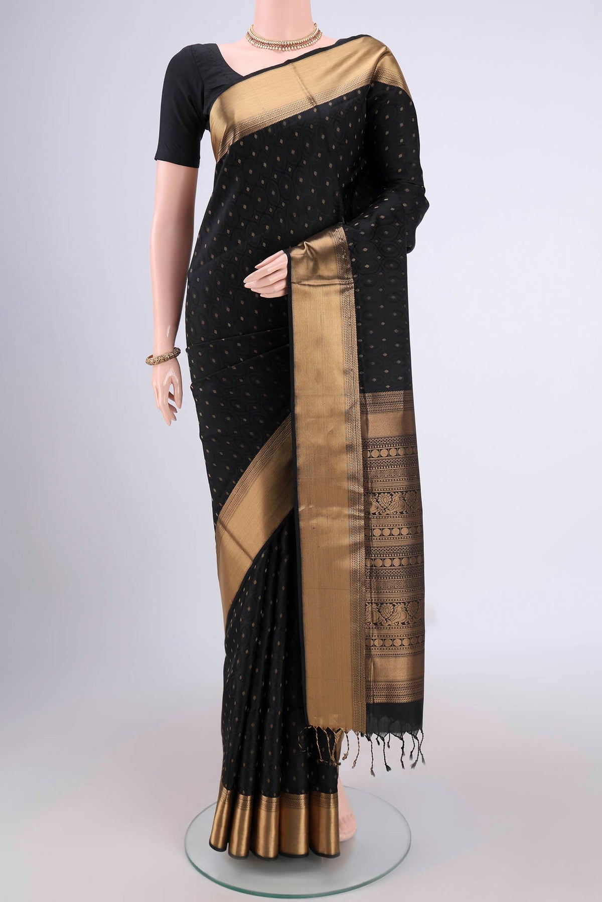 Black Baluchari Silk Saree with Jacquard With Zari Butta on the body and Zari Border.  displayed on a mannequin