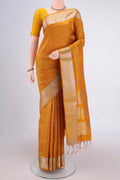 Mustard Soft Silk Saree with Jacquard design on the body and Zari Border.  displayed on a mannequin