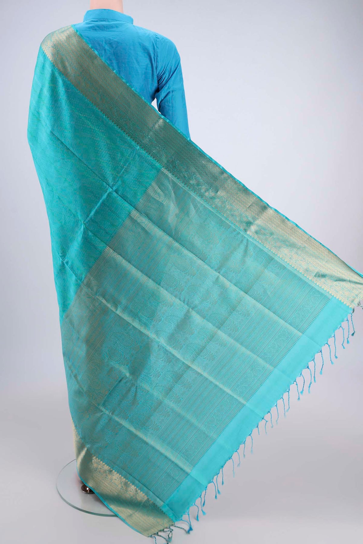Flat view of Turquoise Soft Silk Saree with Jacquard With Zari Butta on the body and Zari Border. 