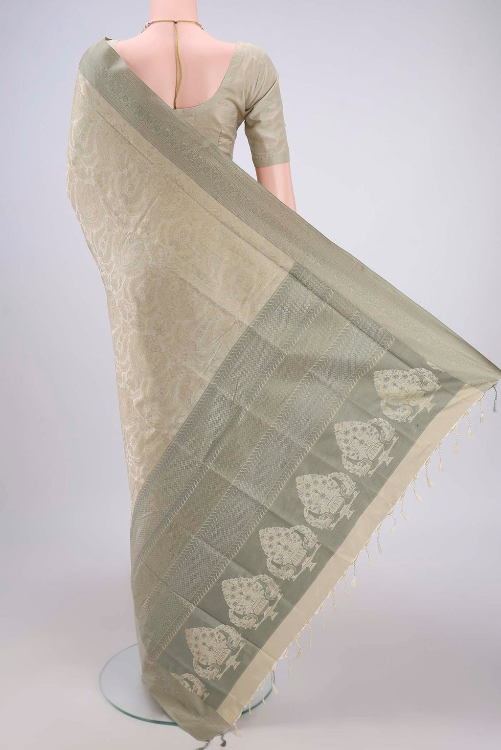 Flat view of Beige Soft Silk Saree with Jacquard design on the body and Thread Border. 