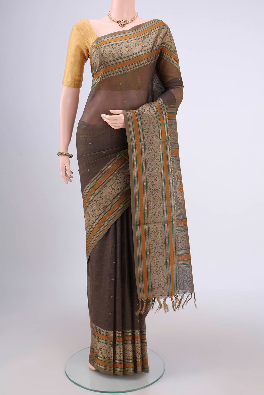 Davys Grey Coimbatore Silk Cotton Saree with Zari Butta on the body and Zari Border.  displayed on a mannequin