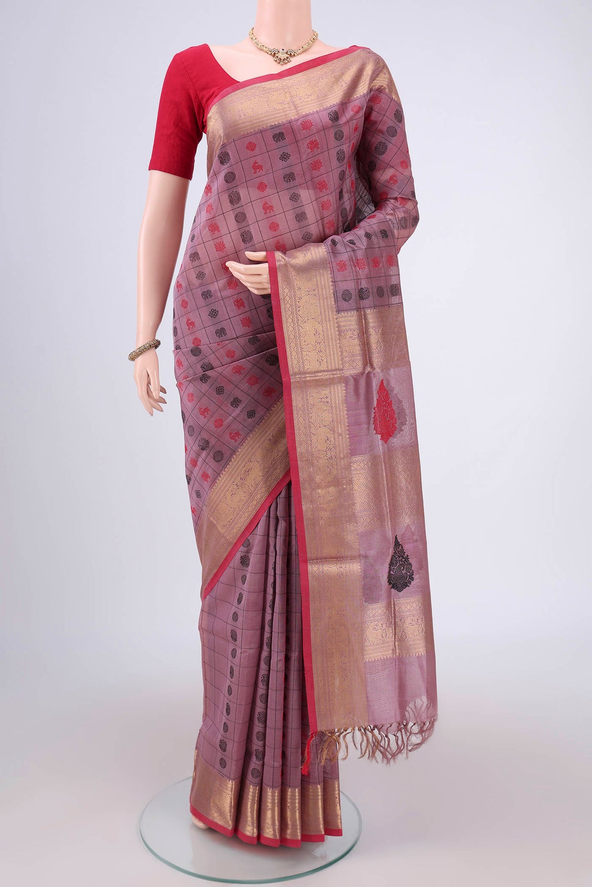 Lavender Coimbatore Silk Cotton Saree with Checked design on the body and Zari Border.  displayed on a mannequin