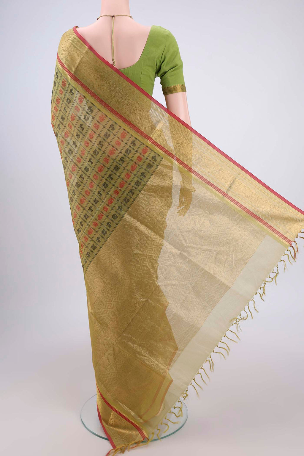 Flat view of Light Green Silk Cotton Saree with Checked design on the body and Zari Border. 