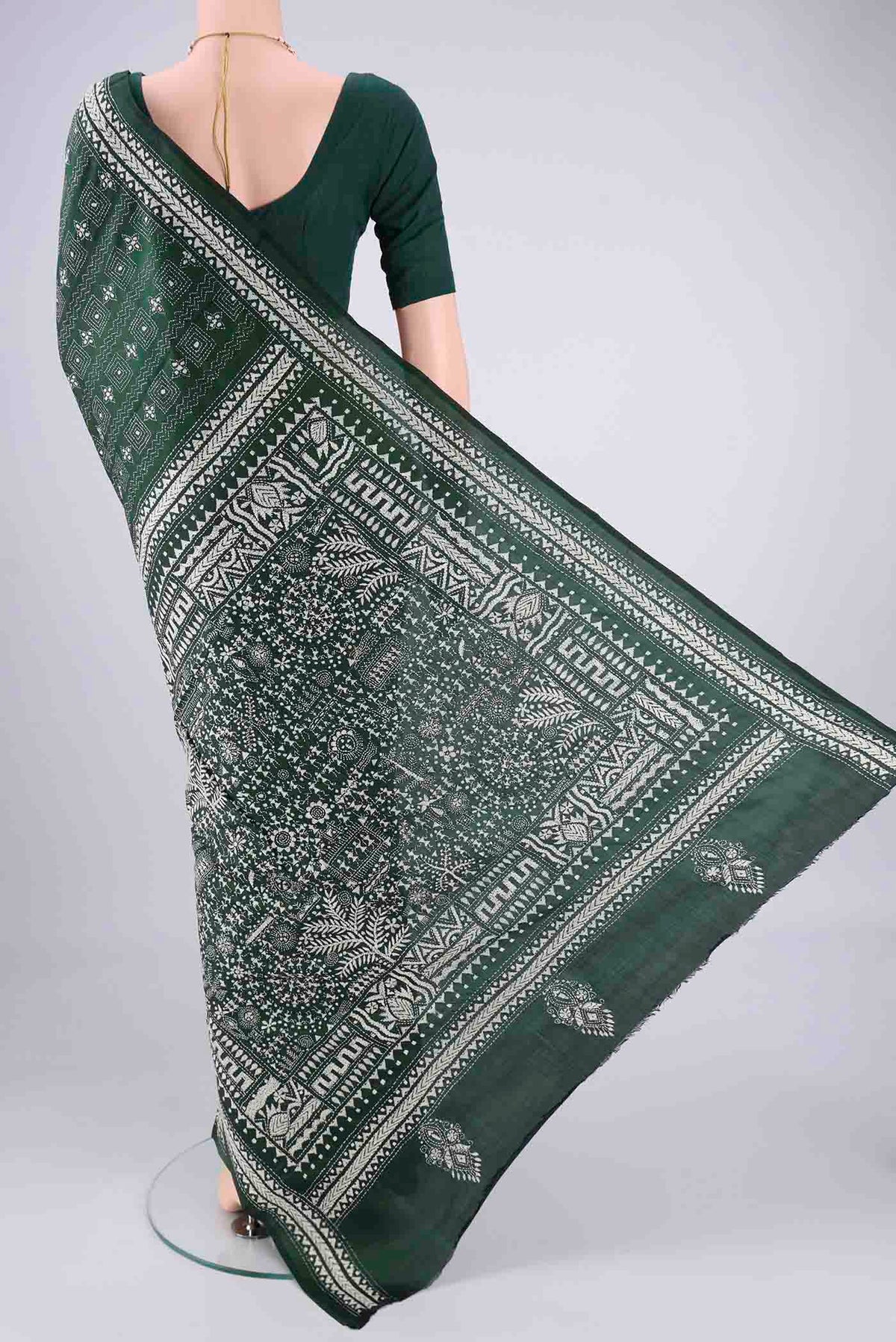 Flat view of Bottle Green Kantha Silk Saree with Kantha Work on the body and Thread Border. 